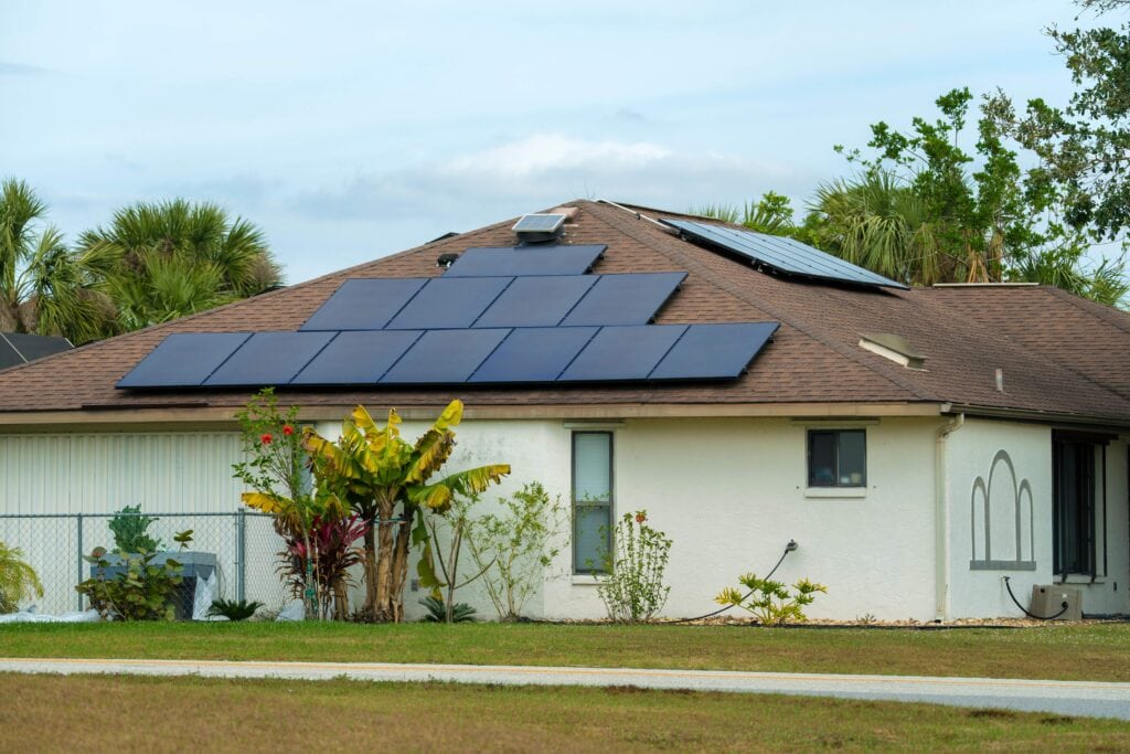 aerial view of regular american home roof with solar panels